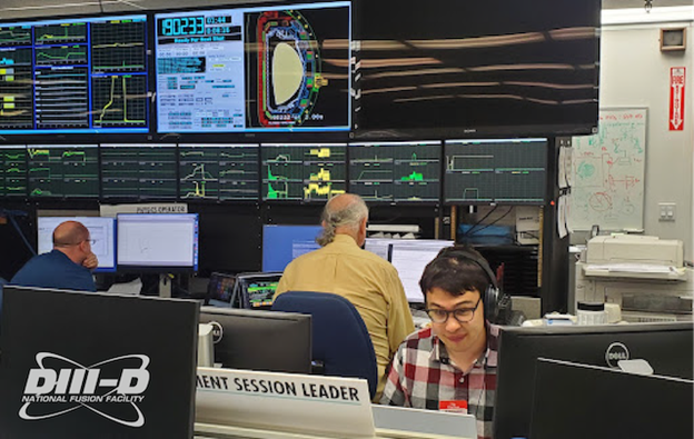 Picture of Ian Char working in the control room of the DIII-D National Fusion Facility.