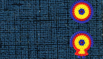 A decorative image of blue fabric with colorful patches.